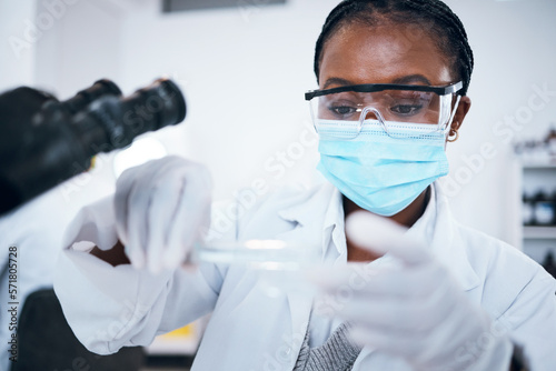Science  covid and solution with a black woman doctor working in a laboratory for research or innovation. Medical  analytics and development with a female scientist at work in a lab for chemistry