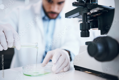 Science, liquid and man with test tube in laboratory for plant research, medicine development and chemistry. Biotechnology, agriculture and scientist with pipette for experiment, study and analysis