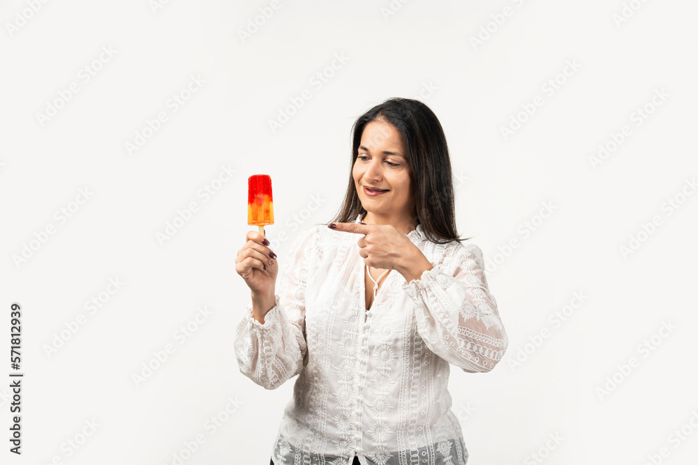 happy asian woman holding ice pop, a lolly frozen stick with mango yellow, fruit ice cream happy asian woman holding ice pop, a lolly frozen stick with mango yellow, fruit ice cream