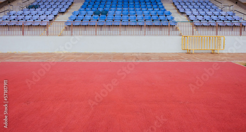 Empty space in front of spectator grandstand in sports stadium
