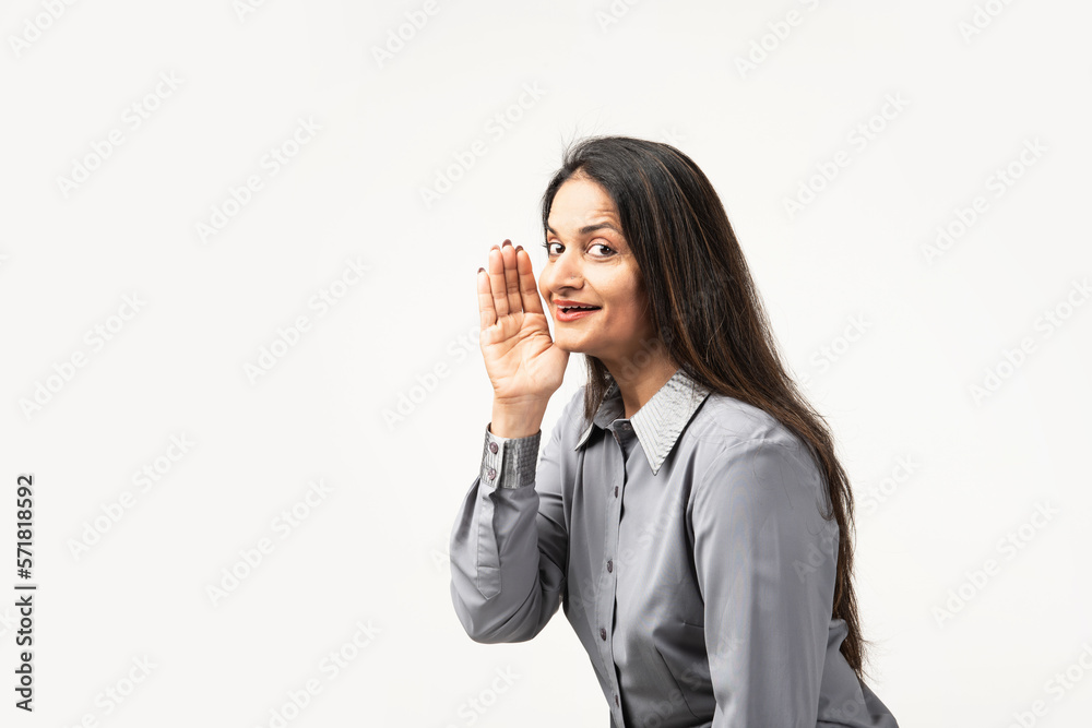 Indian woman hand on mouth telling secret rumor, whispering malicious talk conversation Indian woman hand on mouth telling secret rumor, whispering malicious talk conversation