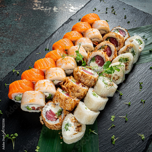 tasty sushi on the wooden background