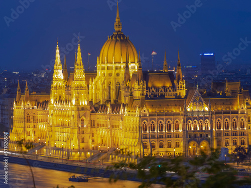 The Hungarian Parliament building on the banks of the Danube in Budapest, illuminated in the evening.