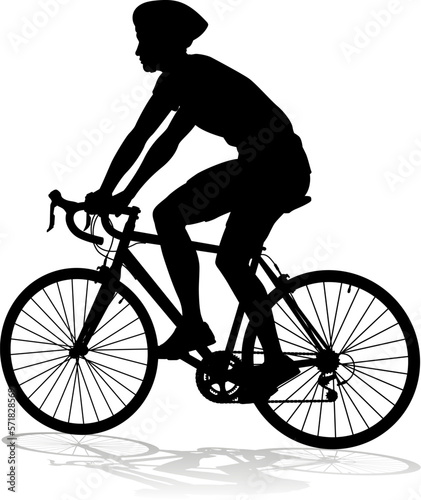 Bicyclist riding their bike and wearing a safety helmet in silhouette
