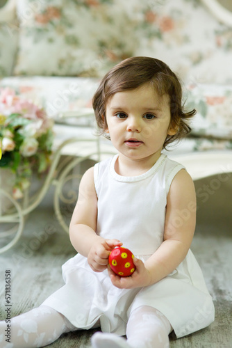 Beautiful little girl with Easter painted eggs.
