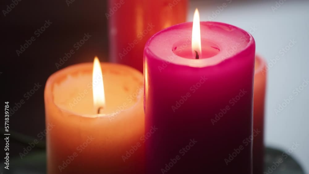 Peach and Pink Candles, with a steady flame. Pushing in. Peach and Pink Candles, with a steady flame. Pushing in.