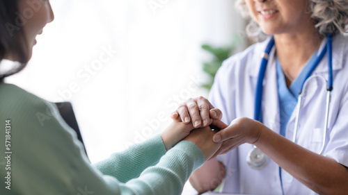Wallpaper Mural Asian female doctor is comforting and counseling a patient to relieve concerns about the disease. Torontodigital.ca