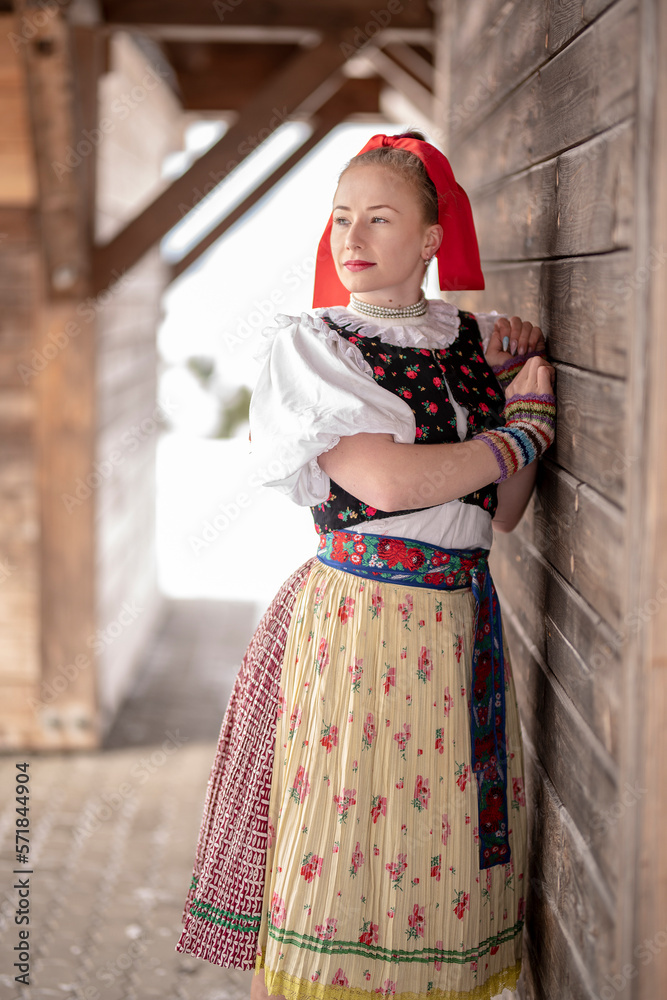 Young beautiful slovak woman in traditional dress. Slovak folklore