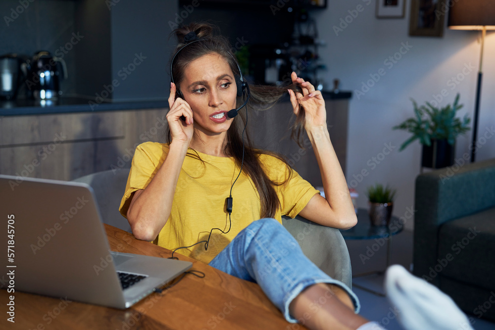 Busy caucasian woman working as call center at home Busy caucasian woman working as call center at home