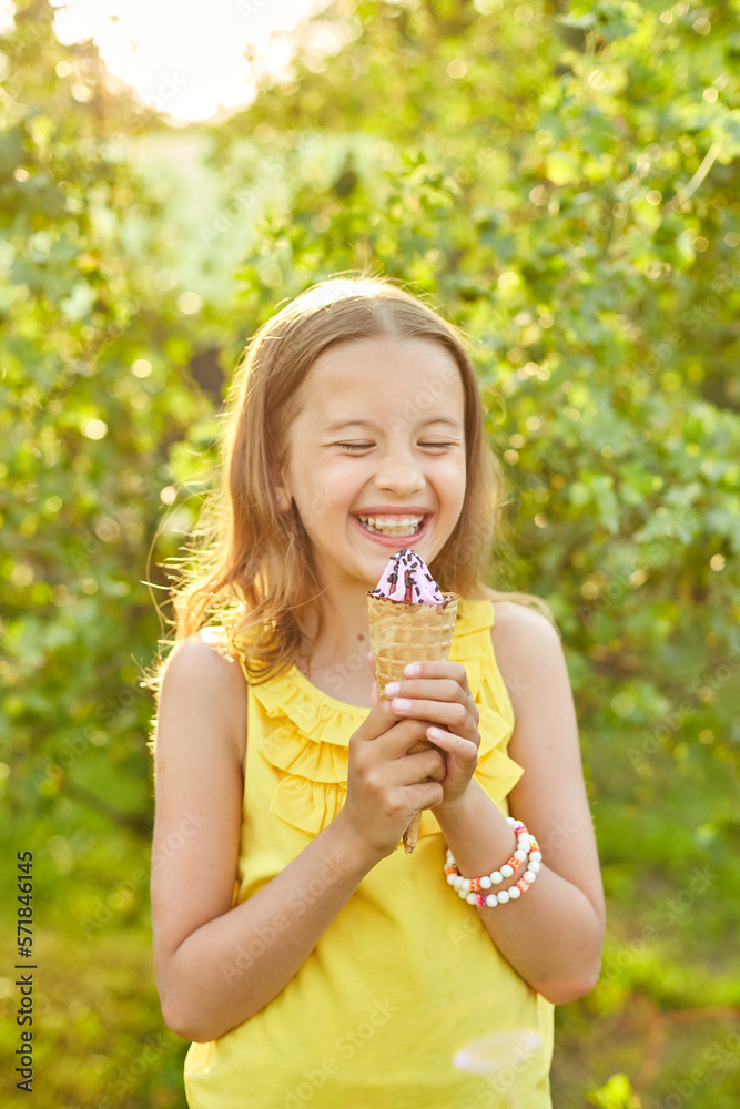 Happy girl with braces eating italian ice cream cone smiling while resting in park on summer day Happy girl with braces eating italian ice cream cone smiling while resting in park on summer day
