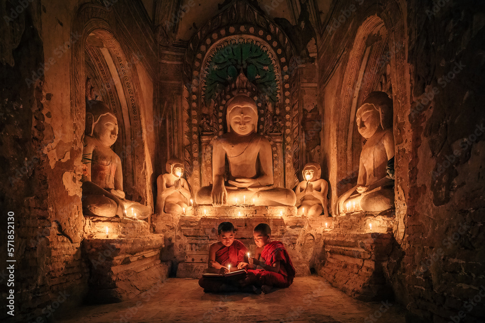 Two buddhist Monk in a pagoda in Bagan Myanmar - obrazy, fototapety, plakaty 