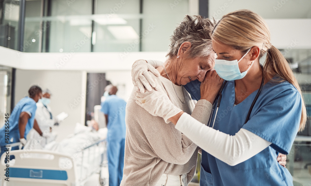 © Courtney/peopleimages.com - Doctor, hug and sad senior woman in hospital for support, comfort and empathy for surgery of husband. Medic, face mask and embrace wife of patient with covid 19 emergency in clinic with solidarity © Courtney/peopleimages.com - Doctor, hug and sad senior woman in hospital for support, comfort and empathy for surgery of husband. Medic, face mask and embrace wife of patient with covid 19 emergency in clinic with solidarity