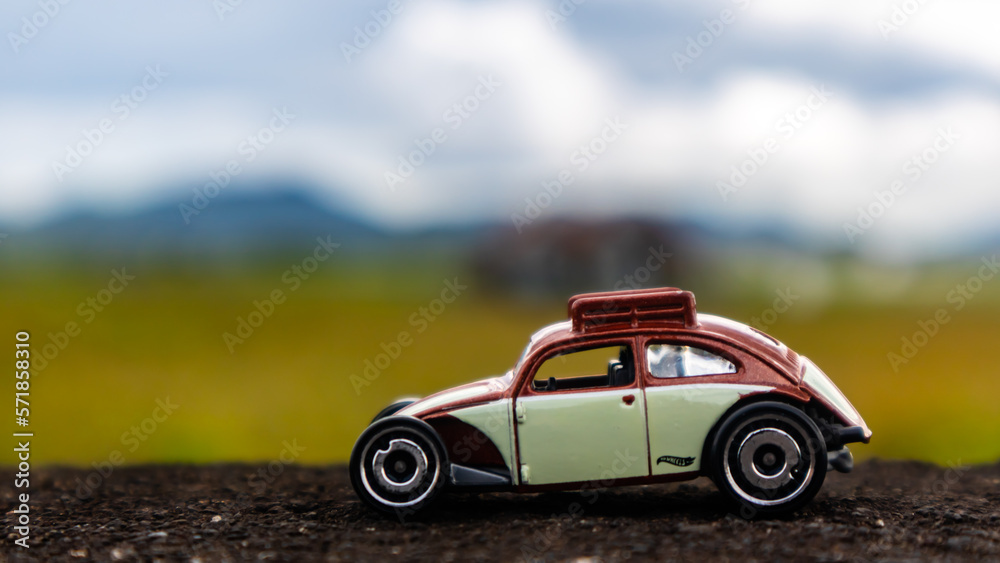 minahasa, Indonesia : January 2023, toy car in the rice field minahasa, Indonesia : January 2023, toy car in the rice field