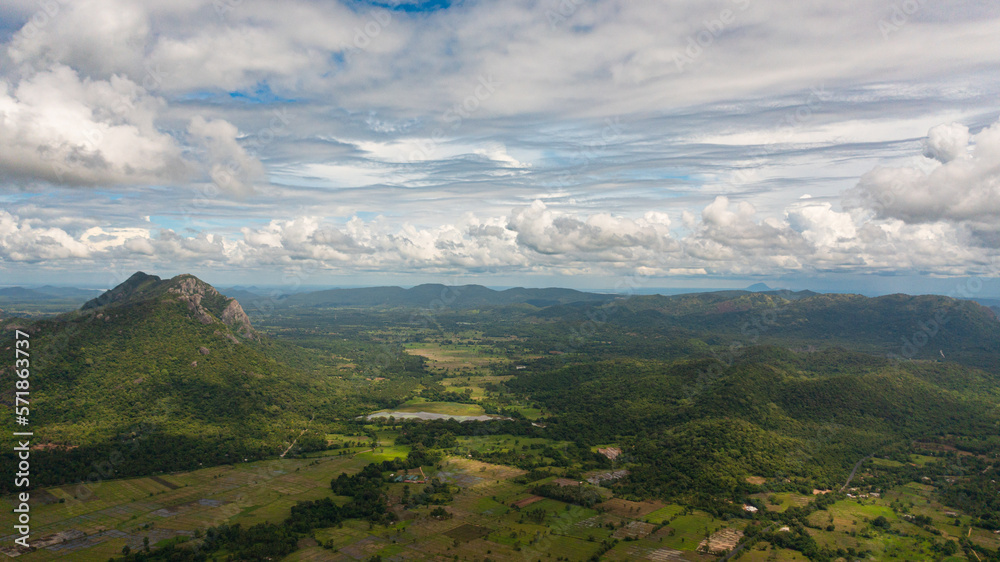 Aerial drone of Agricultural land and mountains with green forest.Sri Lanka.