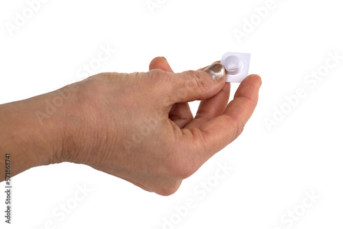 Mani che aprono una pastiglia dal blister photo