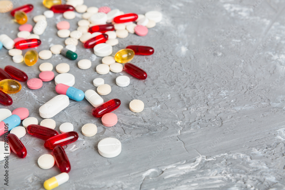 Collection Of Various Medical Tablets And Pills. Assorted pharmaceutical medicine pills, tablets and capsules on table background. Heap of assorted various medicine tablets. Health care