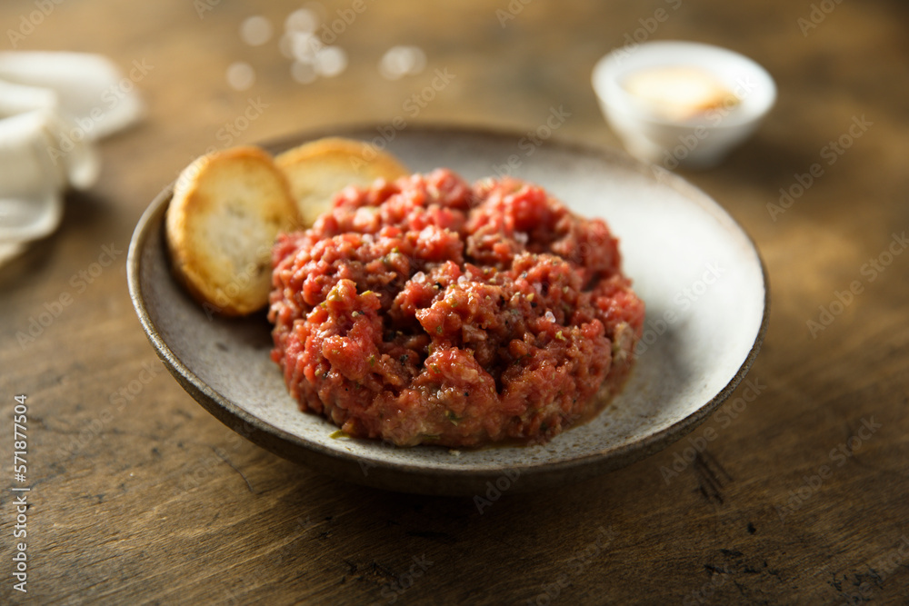 Homemade steak tartare with baguette bread Homemade steak tartare with baguette bread