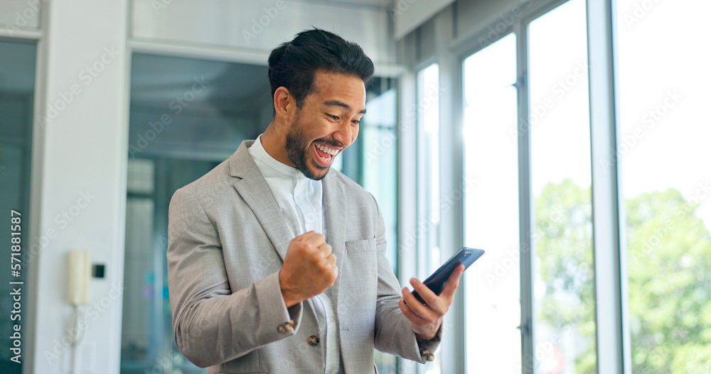Success, phone and winner with businessman in office and celebration for deal, growth and stock market target. Wow, goals and good news with fist of employee for achievement, future and sale Success, phone and winner with businessman in office and celebration for deal, growth and stock market target. Wow, goals and good news with fist of employee for achievement, future and sale