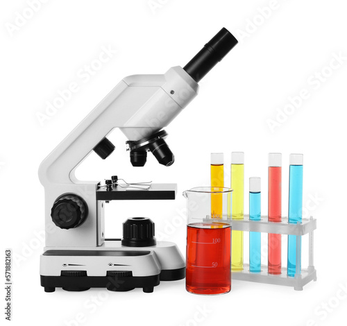 Laboratory glassware with colorful liquids and microscope isolated on white