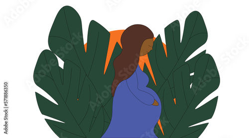 Pregnant stylish girl on the background of leaves
