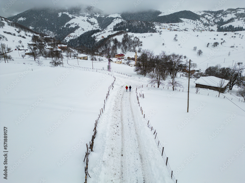 Winter Landscape with Small Village Houses Between Snow Covered Forest in Cold Mountains. Giresun - Turkey Winter Landscape with Small Village Houses Between Snow Covered Forest in Cold Mountains. Giresun - Turkey