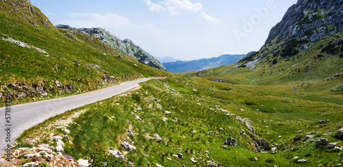 Scenic road way with mountains view in National park Durmitor in Montenegro. Amazing balkan nature in summertime