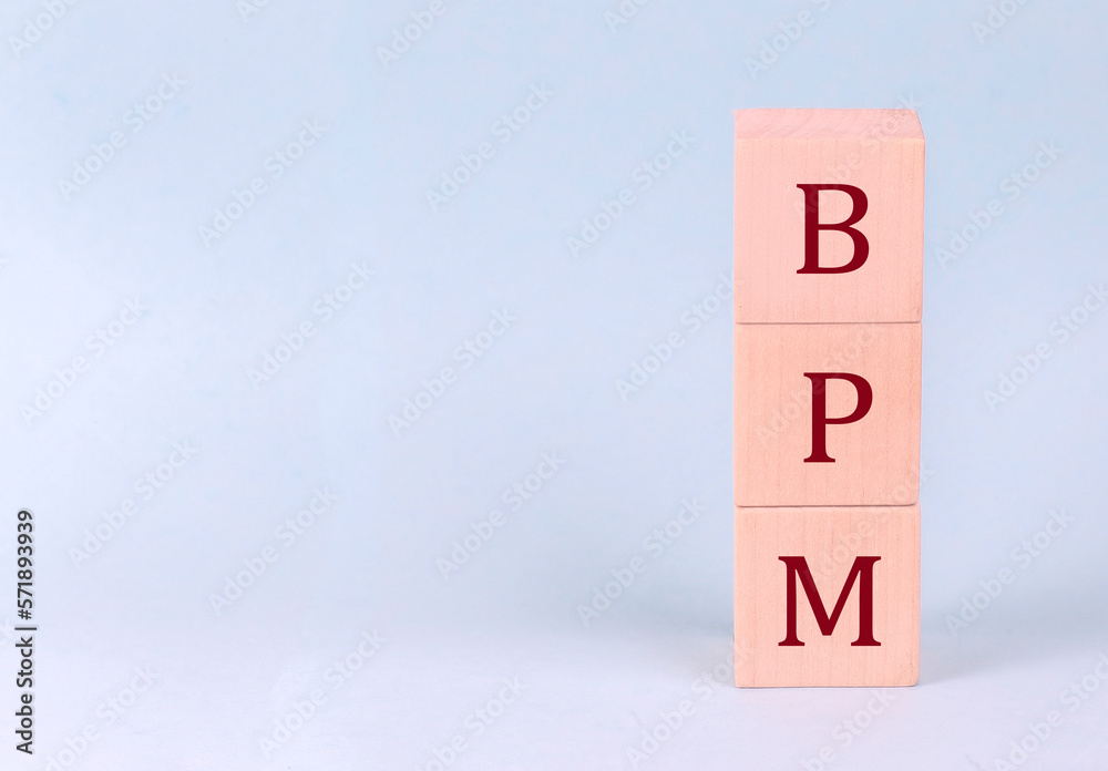BPM on wooden cubes on a blue background BPM on wooden cubes on a blue background