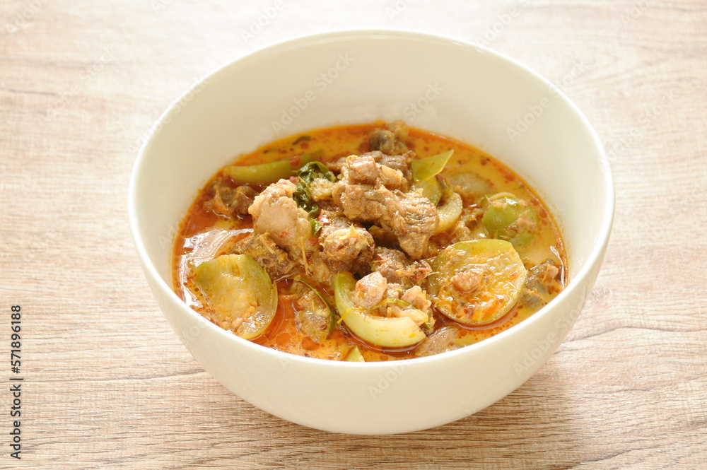 spicy boiled beef meat with eggplant in coconut milk green curry soup on bowl spicy boiled beef meat with eggplant in coconut milk green curry soup on bowl