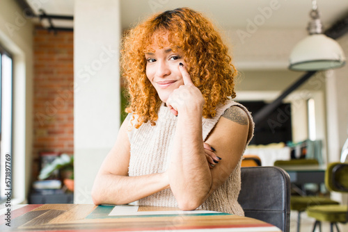 young red hair latin pretty womann at new cool home