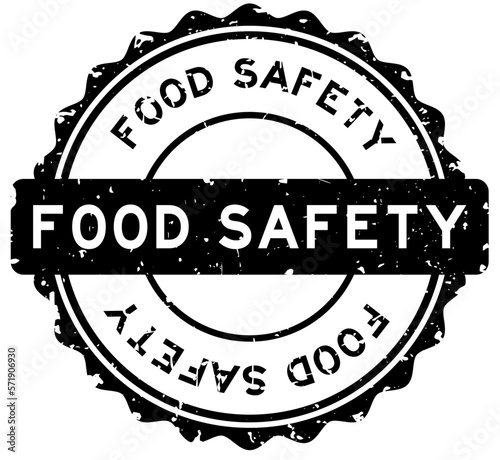 Grunge black food safety word round rubber seal stamp on white background