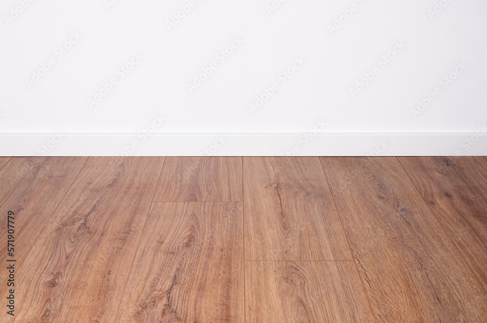 dark oak laminate with white baseboard and white wall as background for design co dark oak laminate with white baseboard and white wall as background for design co