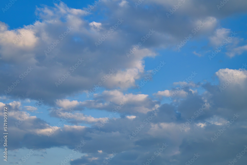 Summer evening sky in the picturesque clouds, lit by the rays of the setting sun. Summer evening sky in the picturesque clouds, lit by the rays of the setting sun.