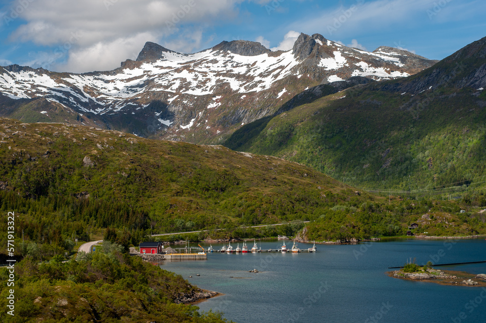 Remote private pier with yachts in Norway fjord between mountains Remote private pier with yachts in Norway fjord between mountains