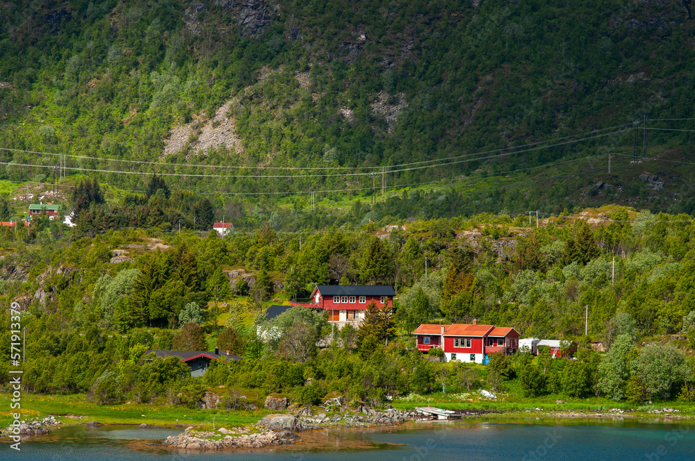 Remote country houses in North of Norway. Just under mountain, sea coast, fjord