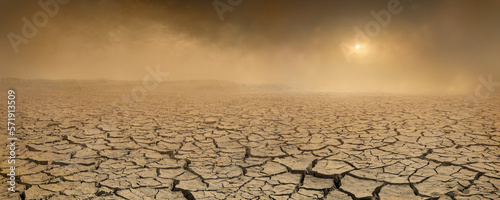 Fotografia, Obraz Wide panorama of barren cracked land with sun barely visible through the dust storm