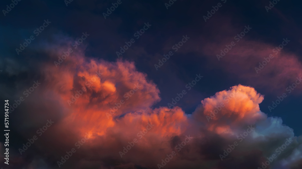 Crimson dramatic sky before rain, panorama. The clouds are lit up at sunset, an unsettling apocalyptic mood