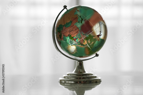 Map of Asia on a crystal globe. isolated on white background. blue glass globe on white backdrop. white transparent crystal earth isolated on white background. Globe of the World. Asia.