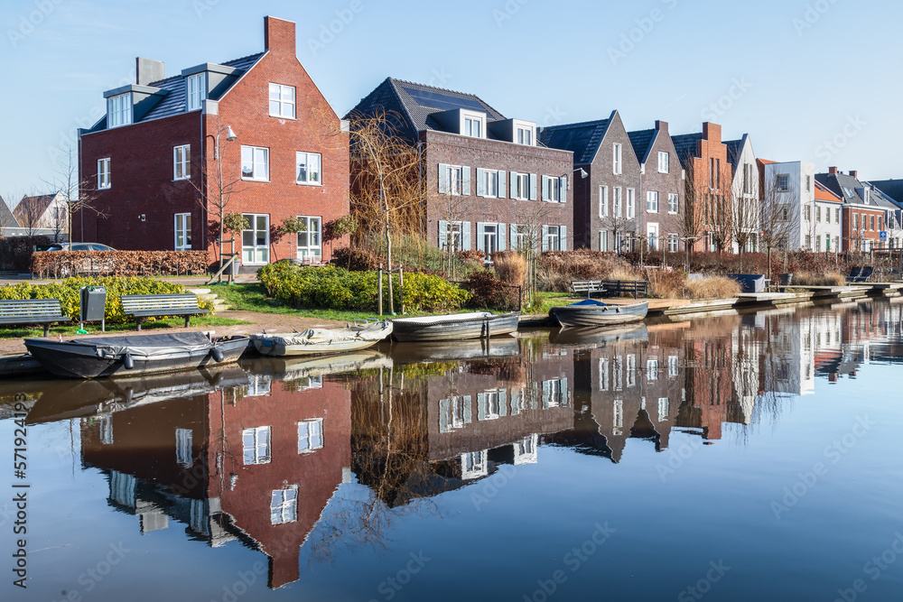 New modern residential buildings along the canal in the Vathorst district in Amersfoort. - obrazy, fototapety, plakaty 