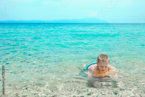 happy child playing at sea in park