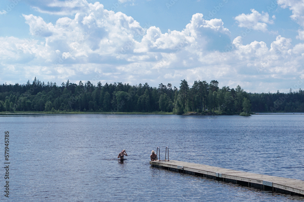 Swimming in the public lake in the countryside of Sweden, Northern Europe