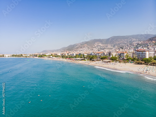 Fototapeta Naklejka Na Ścianę i Meble -  Top view of the tourist city of Alanya located between the mountains and the sea in Turkey, on a sunny summer day