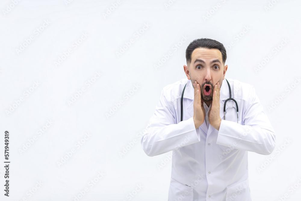 Photo of male mature doctor posing at camera with a stethoscope. Photo of male mature doctor posing at camera with a stethoscope.