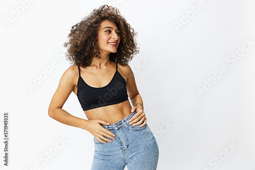 Fotografie Beautiful woman with curly afro hair posing on a white isolated background smile