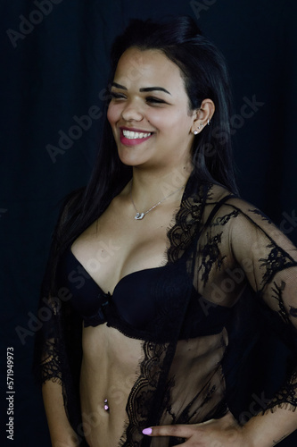 Portrait of a beautiful young Brazilian woman in underwear smiling