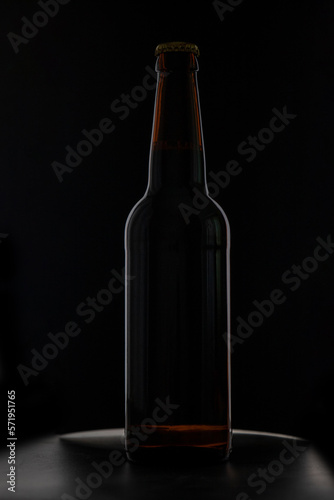 A bottle of beer on a black background