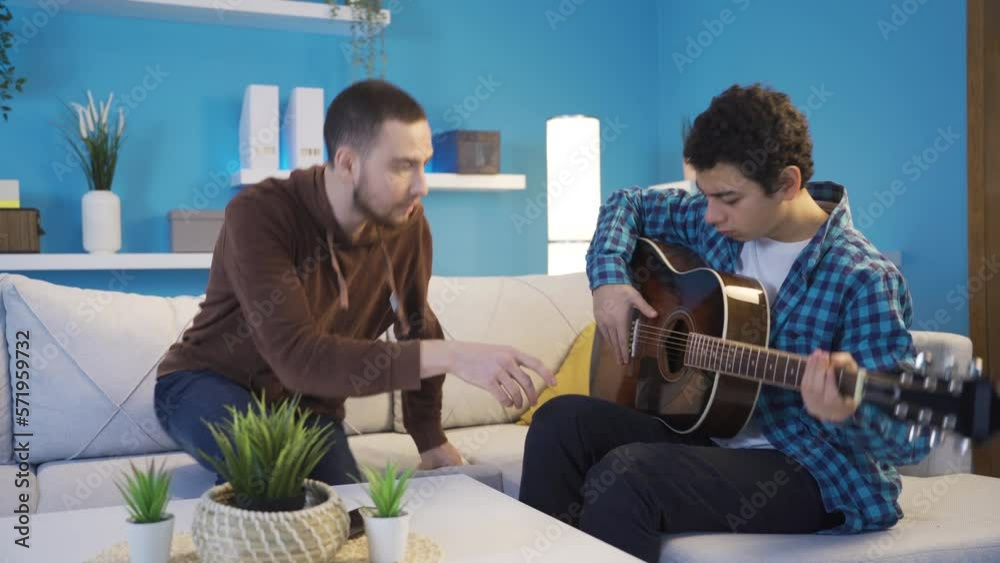 The Cynical Elder Brother Is Teaching His Younger Brother To Play The