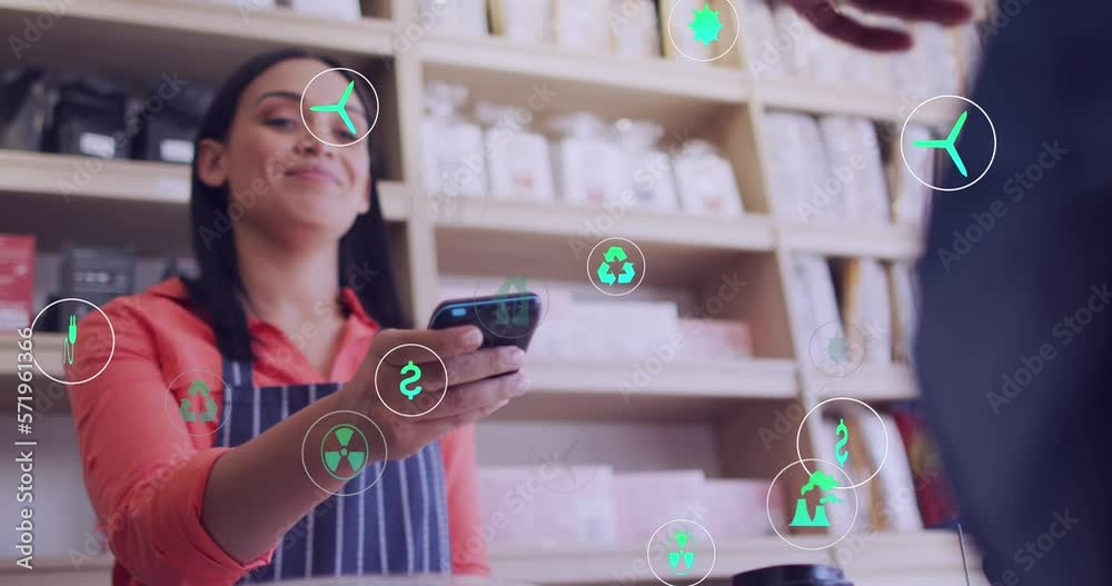 Animation of icons and data processing over biracial woman with payment terminal in cafe