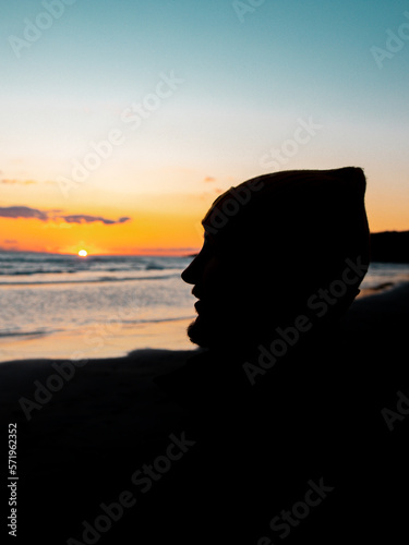 A lonely man on the shore of the Adriatic Sea, a wonderful sunset atmosphere.