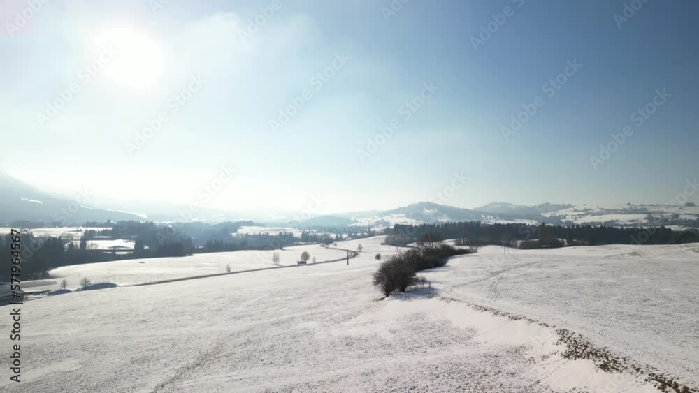 hills covered with snow show the surroundings of the city of nesselwang in the south of bavaria in germany and in the background you can see the alps which are also covered with snow shot with a drone hills covered with snow show the surroundings of the city of nesselwang in the south of bavaria in germany and in the background you can see the alps which are also covered with snow shot with a drone