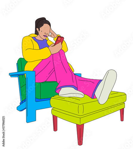 Worried girl texting on a chair with her legs up  photo